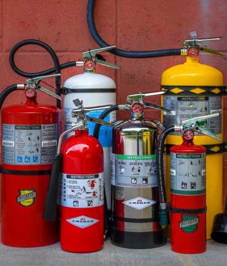Contact Bradley Fire & Environmental Services for Indiana Kitchen Fire Suppression expertise image shows assortment of fire extinguishers
