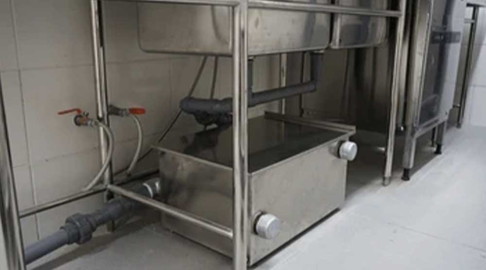 Tackle grease trap cleaning for Indiana Kitchen Fire Suppression image shows grease trap